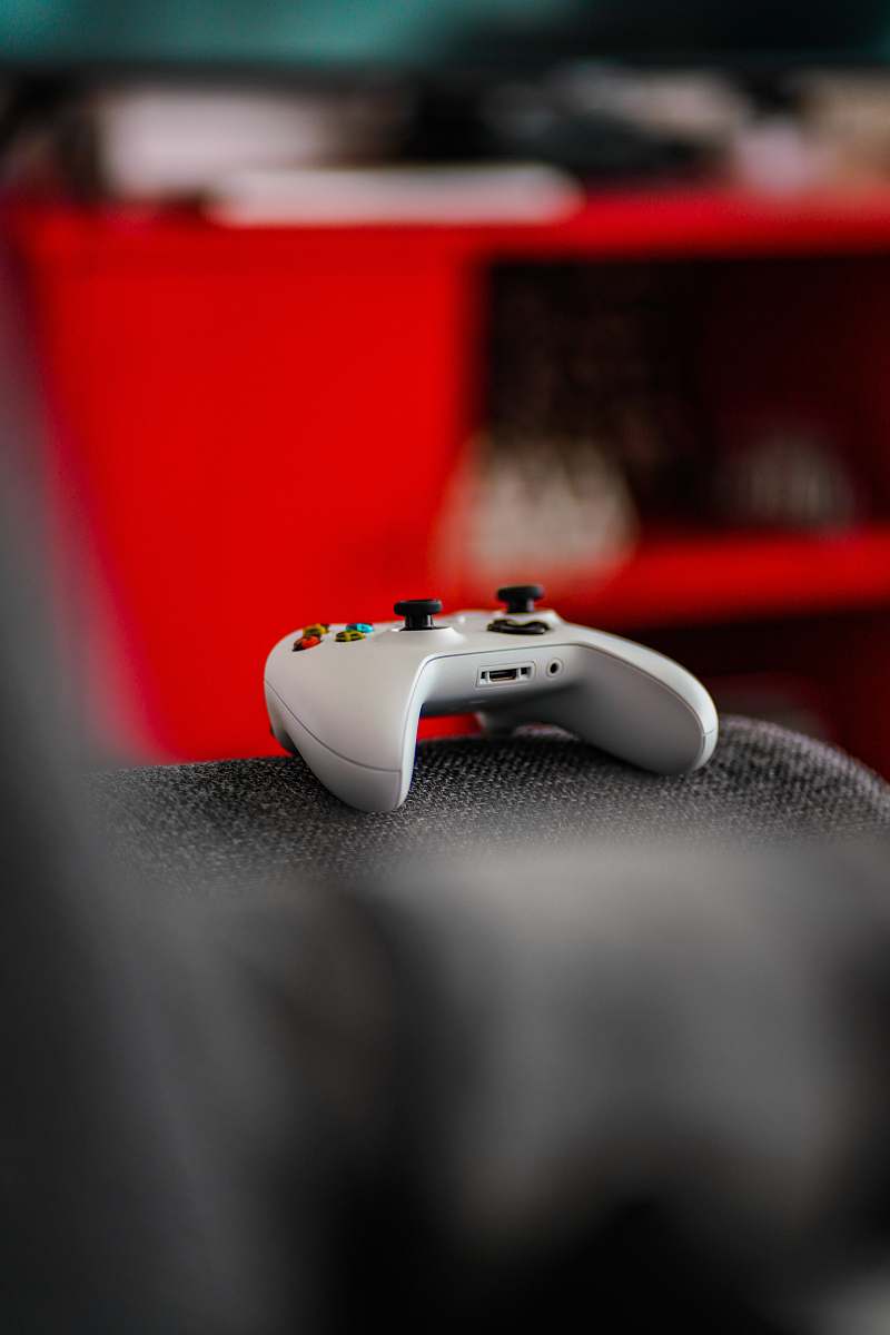 video gaming shallow focus photo of white Microsoft Xbox wireless game controller electronics